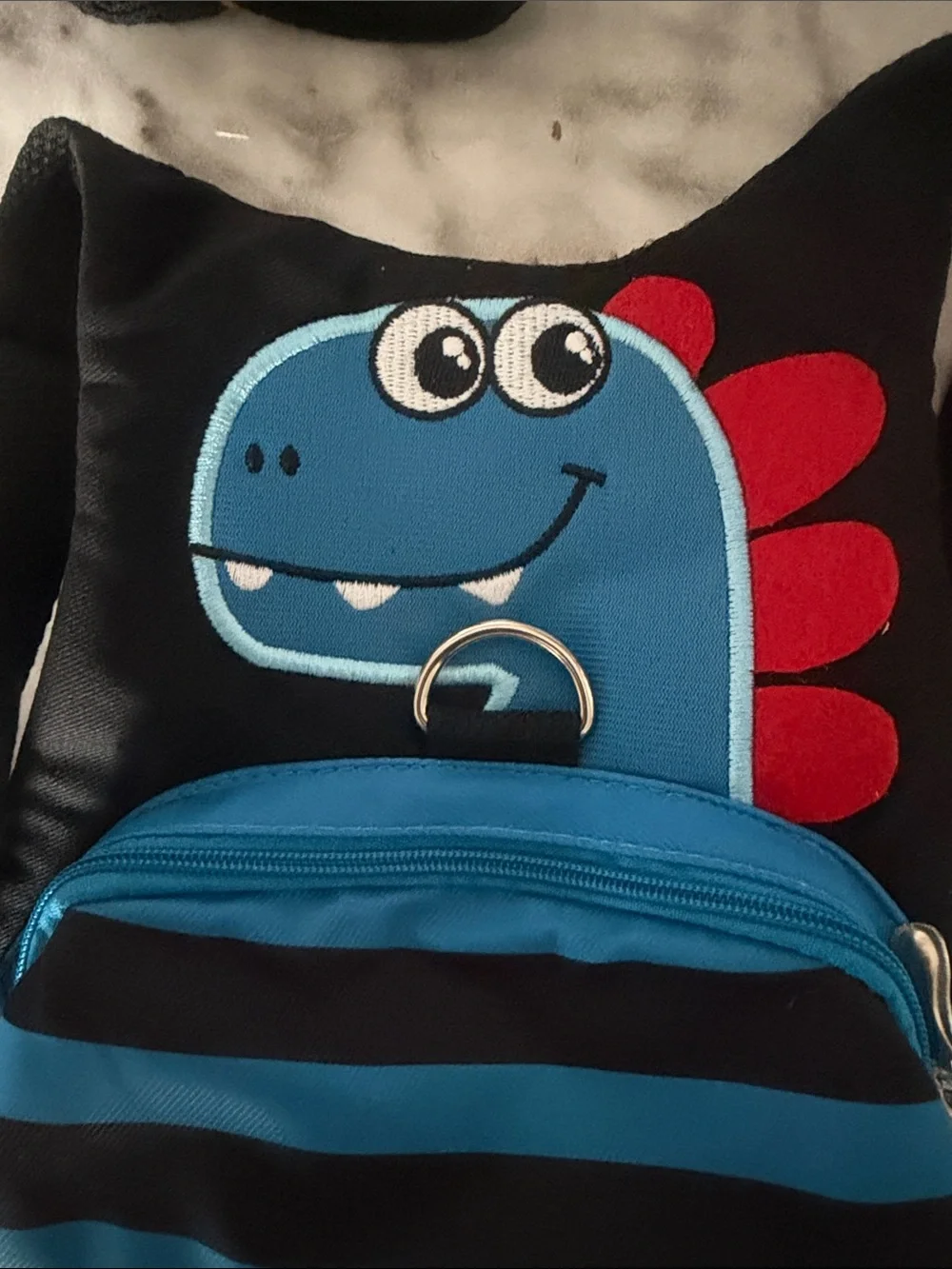 Amazon Kids Dinosaur Safety Harness Backpack in Black, Blue and Red